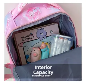 Interior storage view showing books and stationery inside the mermaid kids backpack