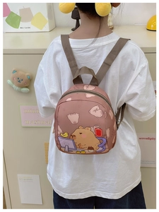 Close-up of pink Capybara backpack for kids with adjustable straps and cute cartoon print