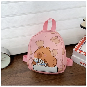 Close-up of pink toddler backpack with cute brown bear and fish print on wood surface