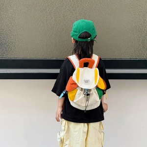 Kids color-block backpack in vibrant canvas with drawstring closure and fashion patch