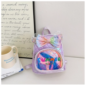 Detail of laser purple quilted kids backpack with sequin bow and transparent ears