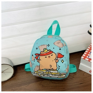 Detail of light blue kids mini backpack with cute cartoon capybara print and green straps