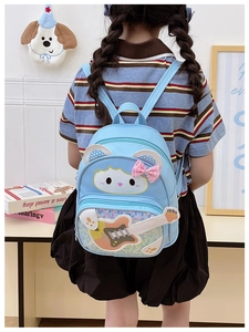 Close-up of a blue sequined kids backpack with guitar illustration and cute cartoon design
