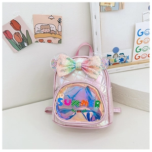 Close-up of holographic pink backpack with sequin bow, ears, and quilted diamond pattern