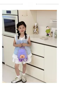Detail view of the purple capybara kids backpack with adjustable straps on a child model
