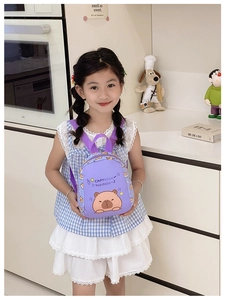 Close-up of a purple Capybara backpack for kids with adjustable shoulder straps