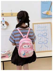 Detailed view of pink toddler backpack with sequins and cute cartoon guitar design