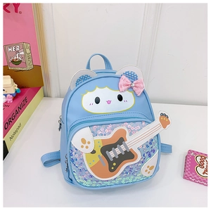 Detail of blue toddler backpack featuring cute animal prints and glittery sequin front pocket