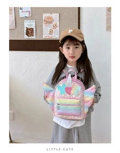 Quilted pink toddler backpack with glitter heart, star patches and rainbow wings detail