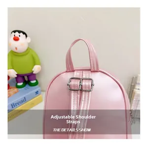 Close-up of pink PU leather toddler backpack with silver metal adjustable buckles