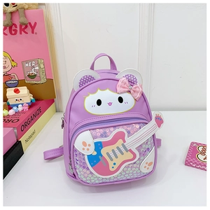 Detail of a purple sequin guitar backpack for kids with a cute cartoon animal design