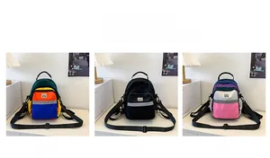 Detailed comparison of kids mini backpacks in green, black, and purple colorways