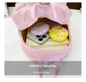Capacité interne du sac à dos enfant à paillettes roses avec téléphone et carnet