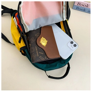 Interior view of colorful kids backpack showing large capacity for phone and wallet