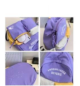 Detail view of large purple canvas backpack with waterproof fabric and multi-pocket design