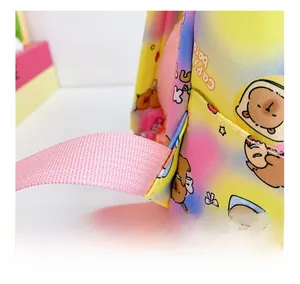 Reinforced triangular stitching detail on a colorful gradient Capybara school backpack