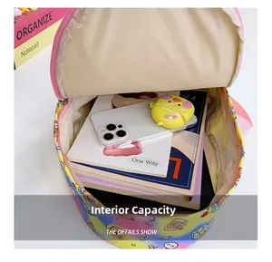 Detailed view of internal capacity showing books and phone inside a cartoon backpack