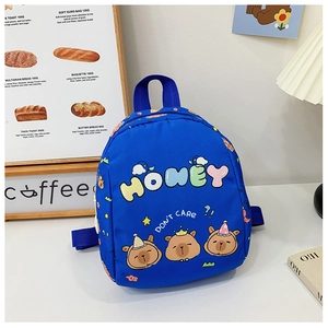 Blue kids backpack with cartoon capybara print and Honey lettering on a wooden table