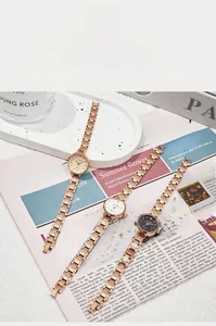 Detail of vintage small dial women's watch with rose gold alloy bracelet and quartz movement