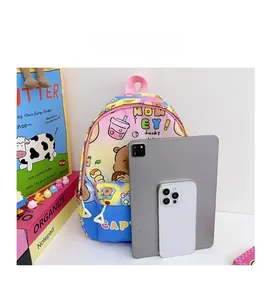 Size comparison of cartoon rainbow kids backpack with Capybara print and mobile phone
