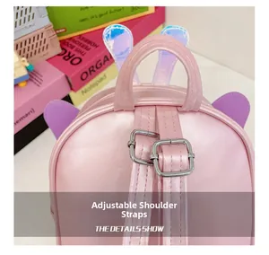 Detail of adjustable pink leather straps and cute bunny ears on toddler backpack