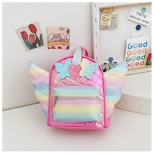 Detail of pink quilted unicorn backpack with rainbow wings and glittery heart patterns