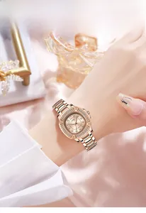 Macro detail of luxury GEDI watch with crystal bezel and rose gold steel strap on wrist
