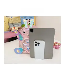 Pink cartoon bunny backpack size comparison with tablet showing sequin detail