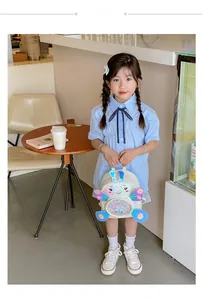 Toddler butterfly backpack with iridescent sequin window and wings worn by a child