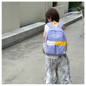Rear view of kid's backpack with purple and yellow contrast stitching and multi-pocket design