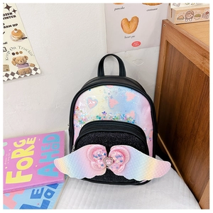 Detail of sequin backpack with heart pattern and rainbow wings for children