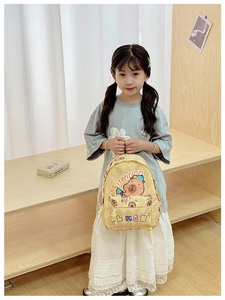 Detail of cute Capybara cartoon print on beige checkered school backpack for kids