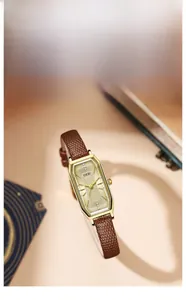 Detail of GEDI vintage square watch with gold octagonal case and brown leather strap