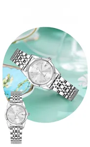 Detailed view of silver steel watch with sunburst dial and elegant rhinestone markers