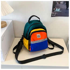 Detail of colorful patchwork nylon kids backpack with Fashion Sweet Dear label