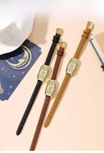 Three elegant vintage square watches in black, brown and yellow leather with gold cases