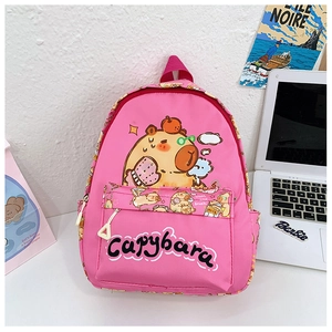 Close-up of bright pink children backpack with cute yellow Capybara cartoon print