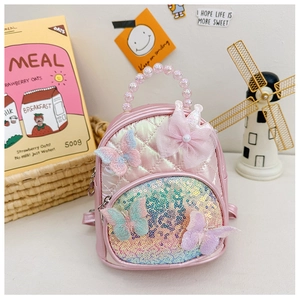 Detail of pink quilted lace butterfly backpack with iridescent sequins and beaded handle