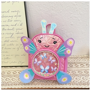 Detail view of pink butterfly backpack with sequin filled transparent window for girls
