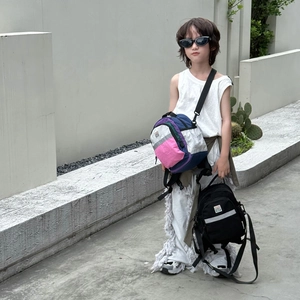 Toddler backpack and crossbody bag with trendy contrast colors and waterproof nylon fabric