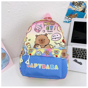 Close-up of the Capybara cartoon backpack showing gradient colors and dual-zipper detail