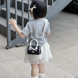 Mini heart bow shoulder bag for girls with white handles and adjustable strap