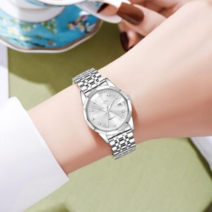 Elegant silver GEDI women watch with diamond markers and date window shown on wrist