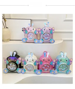 Macro detail of cartoon backpacks with sequin sand and decorative butterfly wings