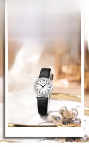Close-up of retro GEDI women's watch with black leather strap and round silver dial case