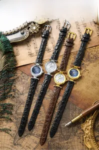 Macro detail of luxury mother-of-pearl dial watches with stone pattern leather straps