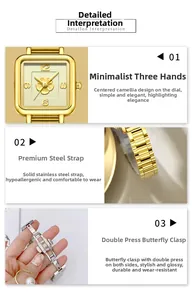Detail of square watch face with golden camellia relief and steel band with butterfly buckle