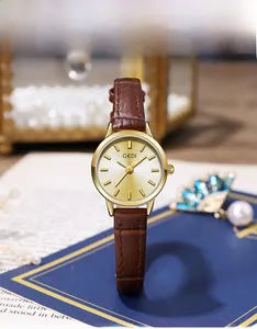 Close-up of GEDI women's watch with champagne gold dial and brown crocodile leather strap