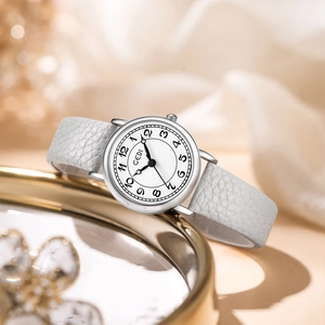 Gedi minimalist women's quartz watch with white leather strap and silver round metal case