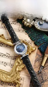Close-up of GEDI ladies watch with blue mother-of-pearl dial and black leather strap
